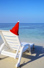 Armchair are waiting you on a white sandy beach