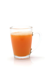 little transparent glass with orange juice