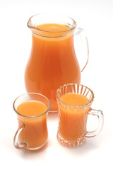 pitcher and glasses full orange juice
