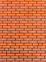Brick red in a wall laying