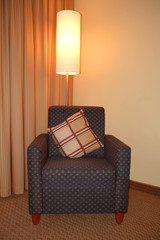 classic armchair and shining lamp