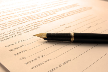 Fototapeta premium Signing a document. Toned in sepia