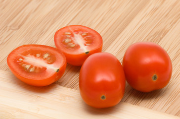 cut tomatoes on chopping board