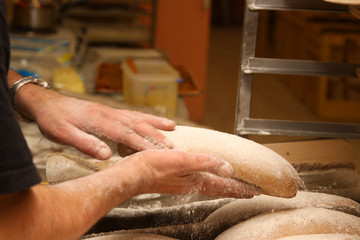 baker who works the paste in a french bakery