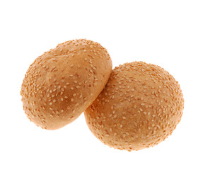 bun for sandwich. A bakery product strewed by grains
