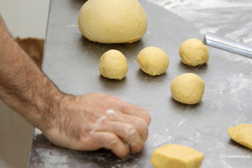 baker who works the paste in a french bakery