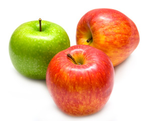 The green and red apples on white. Isolation, shallow DOF.