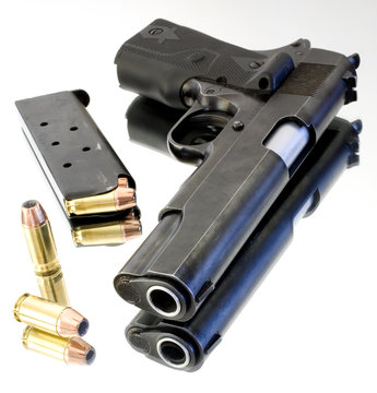 Semi Automatic Pistol With A Magazine And Bullets