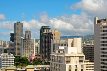 Honolulu hotels towering over a vintage little pink structure