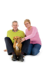 Elderly couple with their pet