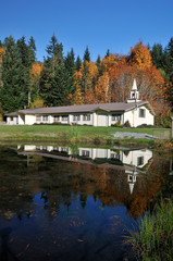 Fototapeta premium Small rural church with autumn color