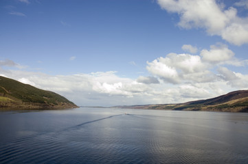 Loch Ness in Scotland with a wake from a boat