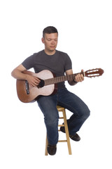 Guitarist playing isolated on a white background