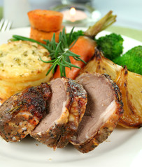 Baked lamb and potato stack with onions, beans and broccoli