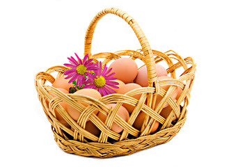Fototapeta na wymiar Basket with eggs the isolated on a white background