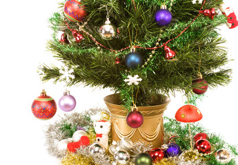 Artificial Christmas tree draped with traditional decorations