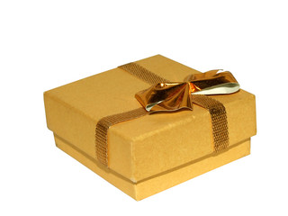 Closed golden gift box isolated on white, with clipping path