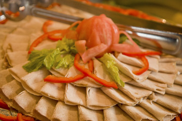 A nice deli platter of sliced turkey