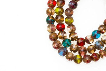 Mala made of colored glass. Isolated on white.