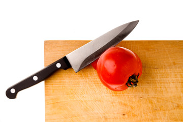 tomato and knife isolated on white background