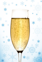 Glass of champagne with New Year's decor.