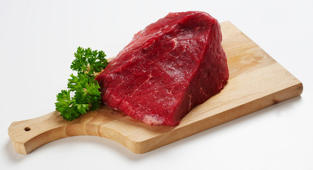 Piece of beef on wooden desk