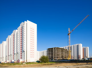 Fototapeta na wymiar New buildings on blue sky background.
