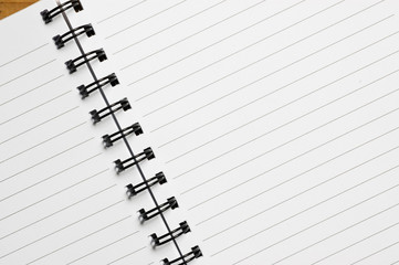 Spiral notebook, with lined sheets, close up shot.