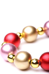 Christmas decoration of shining beads isolated on white