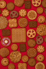 sweet background: different pastry on the red