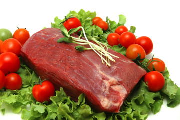 fresh red meat on green salad leaf