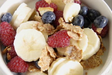 bowl of cereal with lots of  fresh fruit