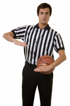 Man basketball referee calling a foul