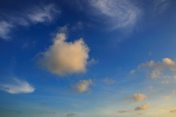 Detail of tropical sky with soft sunset colored clouds