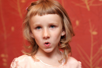 A girl makes a grimace at home