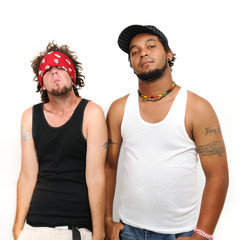 Portrait of two young cool guys posing isolated