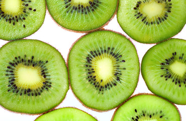 Green kiwi macro sliced cuts isolated on white (food background)