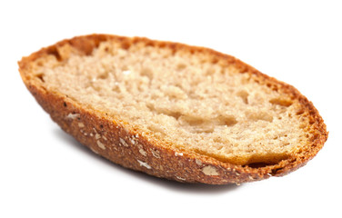 crust of whole wheat bread  on light background
