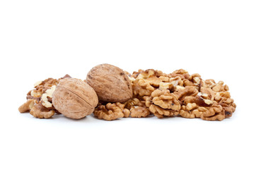 Two walnuts and some kernels isolated on the white background