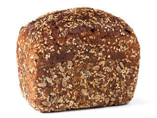 loaf of whole rye bread on light background