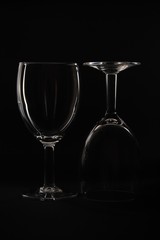 Two Empty wine glass isolated on black background.