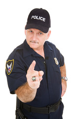 Angry looking police officer pointing his finger at you.