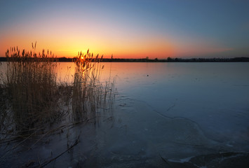 Frozen lake at sunset