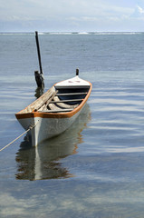 Beach scene with floating boat.