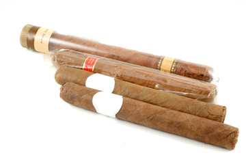 four aromatic  Cuban cigars isolated on a white background