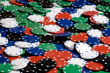 A background with casino chips of many colors