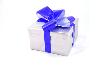 Silver gift box with blue bow isolated on white