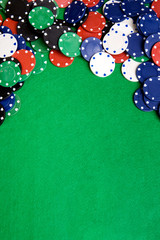 Casino chips on a green felt - background image