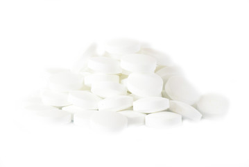Fototapeta na wymiar white round vitamins on the white isolated background