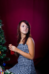 girl decorating the Christmas tree